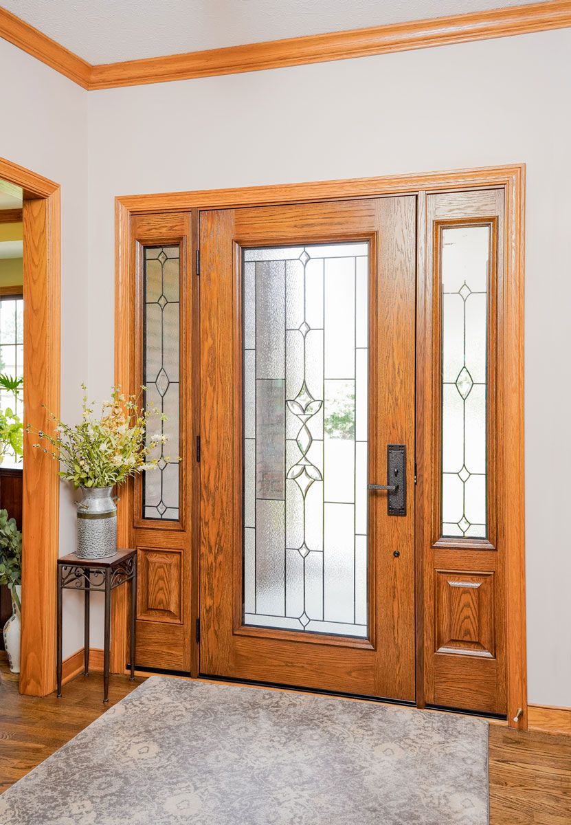 beautiful entry door with custom glass and wood finish