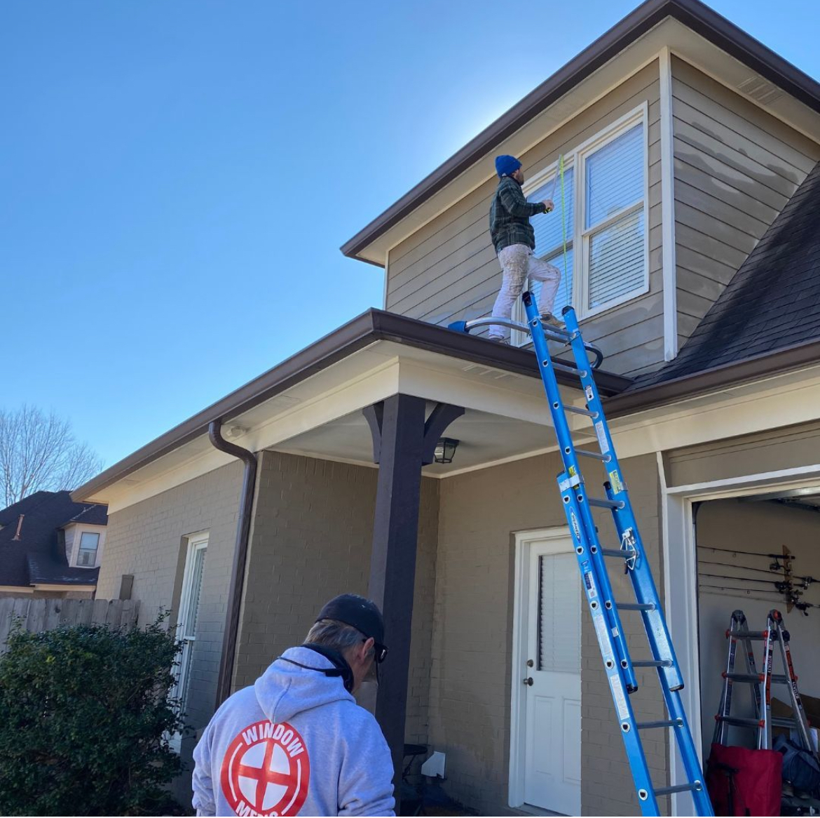 Window Medic installing new vinyl windows on a home in Memphis.